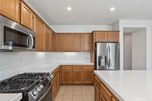 Interior, Kitchen, Recessed Lighting, Stainless Steel Appliances, Tile Countertops