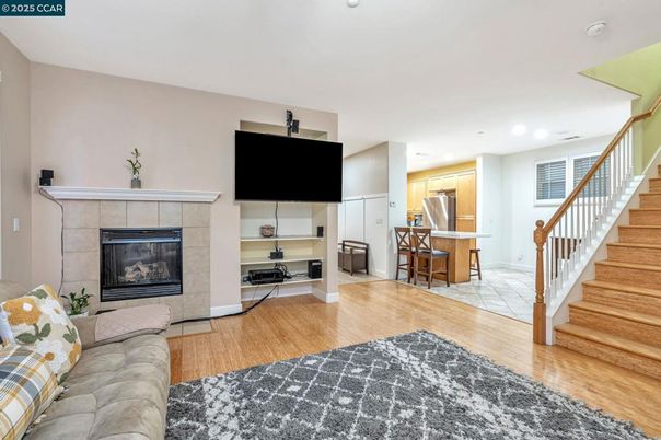 Fireplace, Interior, Kitchen, Living room, Recessed Lighting, Stainless Steel Appliances, Wood Texture Flooring