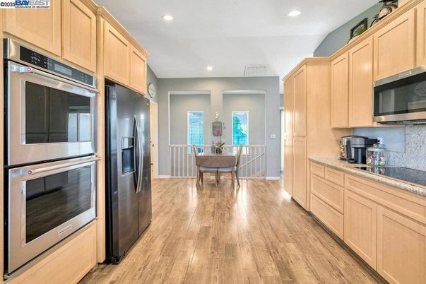 Dining room, Interior, Kitchen, Recessed Lighting, Stainless Steel Appliances, Wood Texture Flooring