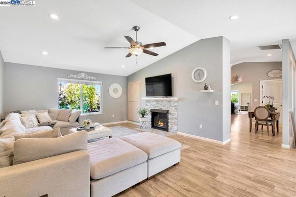 Dining room, Fireplace, Interior, Living room, Recessed Lighting, Wood Texture Flooring