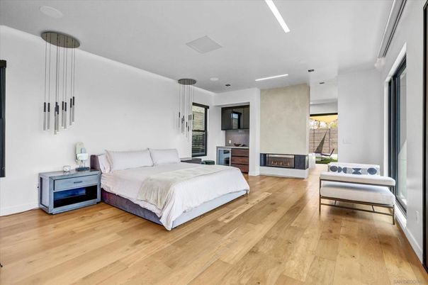 Bedroom, Fireplace, Interior, Pendant Lights, Recessed Lighting, Wood Texture Flooring