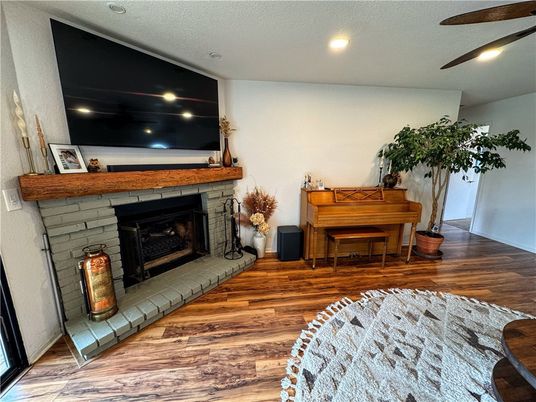 Fireplace, Interior, Piano, Recessed Lighting, Wood Texture Flooring