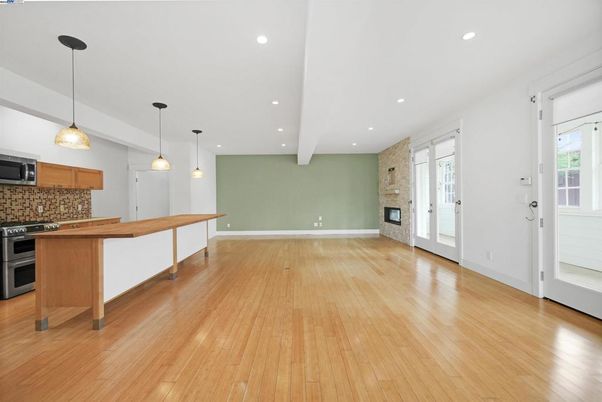 Empty room, Fireplace, Interior, Kitchen, Pendant Lights, Recessed Lighting, Wood Texture Flooring