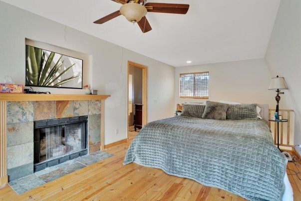 Bedroom, Fireplace, Interior, Recessed Lighting, Wood Texture Flooring