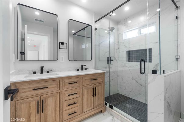 Bathroom, Dual Sink Vanities, Glass Shower, Interior, Marble, Marble Walls, Recessed Lighting