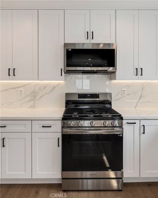 Interior, Kitchen, Marble Walls, Stainless Steel Appliances, Wood Texture Flooring