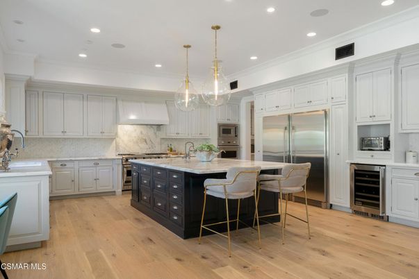 Interior, Kitchen, Marble Walls, Pendant Lights, Recessed Lighting, Stainless Steel Appliances, Wood Texture Flooring