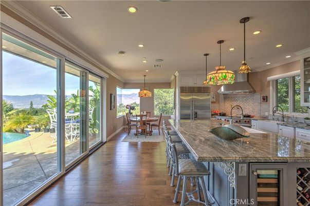 Dining room, Interior, Kitchen, Pendant Lights, Recessed Lighting, Stainless Steel Appliances, Wood Texture Flooring