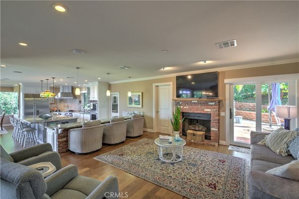 Dining room, Fireplace, Interior, Kitchen, Living room, Pendant Lights, Recessed Lighting, Stainless Steel Appliances, Wood Texture Flooring