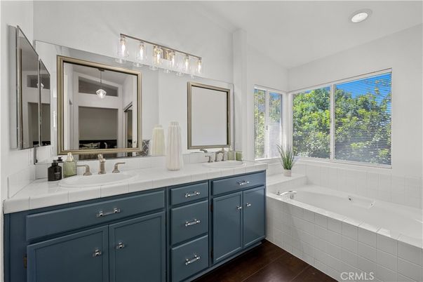 Bathroom, Dual Sink Vanities, Interior, Recessed Lighting, Tile Countertops, Wood Texture Flooring