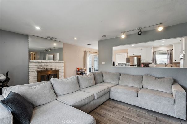 Fireplace, Interior, Kitchen, Living room, Recessed Lighting, Stainless Steel Appliances, Wood Texture Flooring