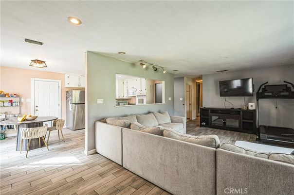 Dining room, Interior, Kitchen, Living room, Recessed Lighting, Stainless Steel Appliances, Wood Texture Flooring