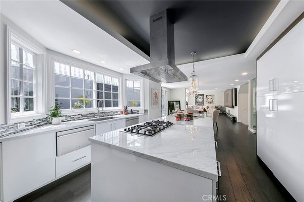 Chandelier, Dining room, Interior, Kitchen, Living room, Pendant Lights, Recessed Lighting, Stainless Steel Appliances, Wood Texture Flooring