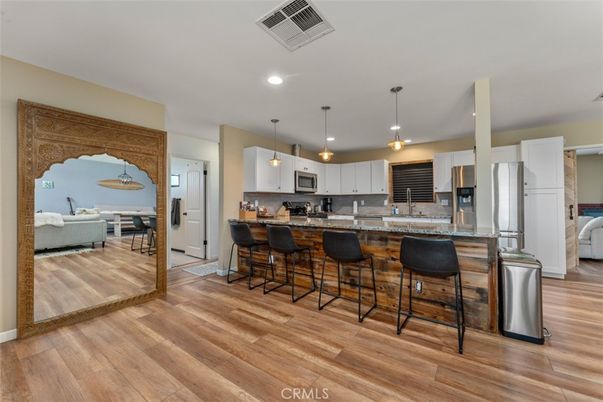 Dining room, Interior, Kitchen, Pendant Lights, Recessed Lighting, Stainless Steel Appliances, Wood Texture Flooring