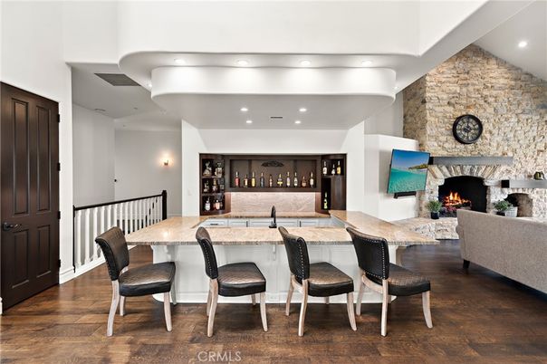 Fireplace, Interior, Living room, Recessed Lighting, Stone Walls, Wood Texture Flooring