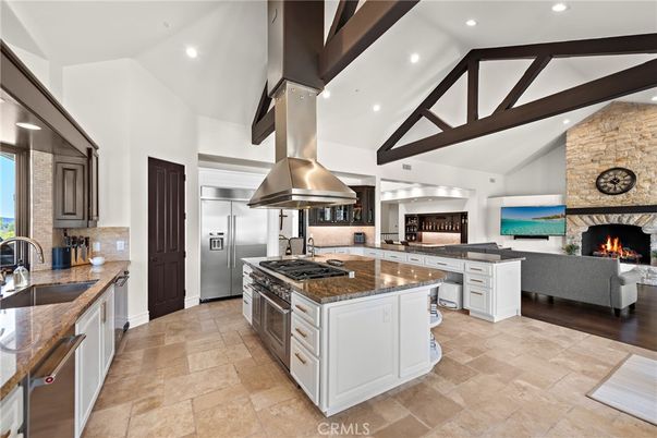 Fireplace, Interior, Kitchen, Living room, Recessed Lighting, Stainless Steel Appliances, Stone Walls, Wooden Beams