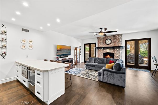 Dining room, Fireplace, Interior, Kitchen, Living room, Recessed Lighting, Wood Texture Flooring