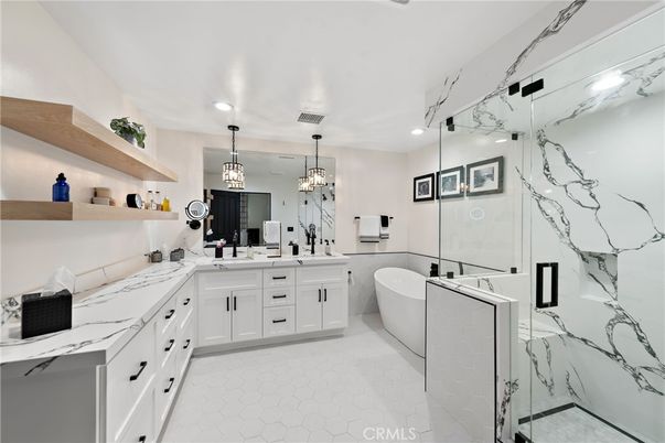 Bathroom, Dual Sink Vanities, Free Standing Baths, Glass Shower, Interior, Marble Walls, Pendant Lights, Recessed Lighting