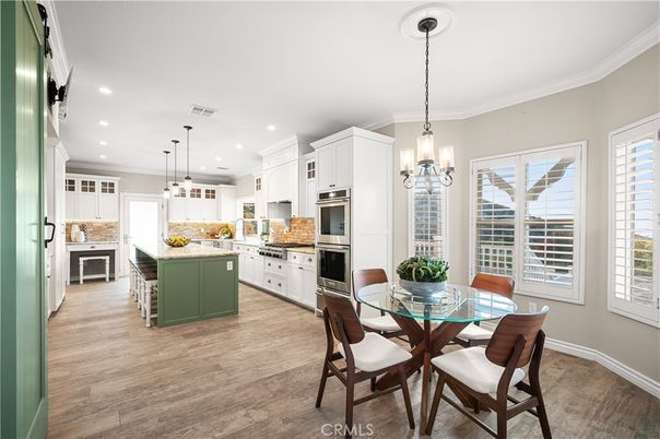 Dining room, Interior, Kitchen, Pendant Lights, Recessed Lighting, Stainless Steel Appliances, Wood Texture Flooring