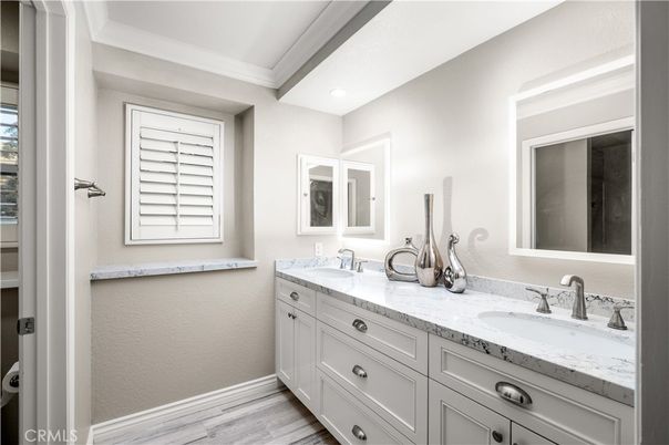 Bathroom, Dual Sink Vanities, Interior, Recessed Lighting, Wood Texture Flooring