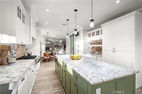Chandelier, Dining room, Interior, Kitchen, Pendant Lights, Recessed Lighting, Stainless Steel Appliances, Wood Texture Flooring