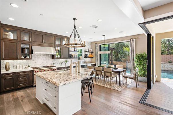 Dining room, Interior, Kitchen, Pendant Lights, Recessed Lighting, Stainless Steel Appliances, Wood Texture Flooring