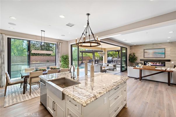 Dining room, Fireplace, Interior, Kitchen, Living room, Pendant Lights, Recessed Lighting, Wood Texture Flooring