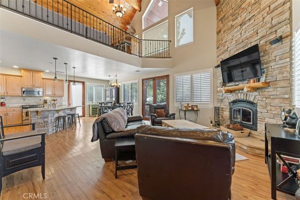 Chandelier, Dining room, Fireplace, Interior, Kitchen, Living room, Pendant Lights, Recessed Lighting, Stone Walls, Wood Texture Flooring