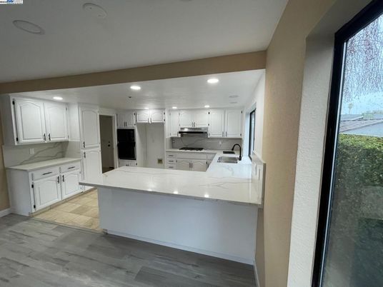 Interior, Kitchen, Marble Walls, Recessed Lighting, Wood Texture Flooring