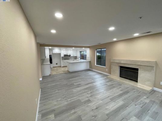 Empty room, Fireplace, Interior, Kitchen, Recessed Lighting, Wood Texture Flooring