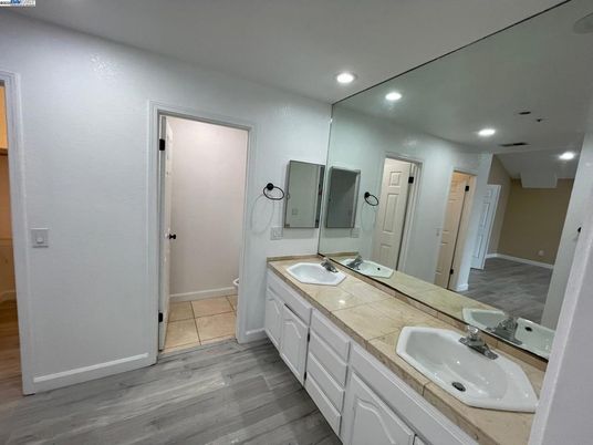 Bathroom, Dual Sink Vanities, Interior, Recessed Lighting, Tile Countertops, Wood Texture Flooring