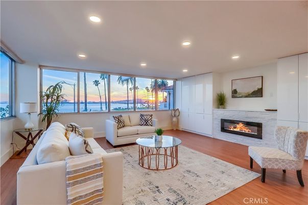 Fireplace, Interior, Living room, Recessed Lighting, Water, Wood Texture Flooring