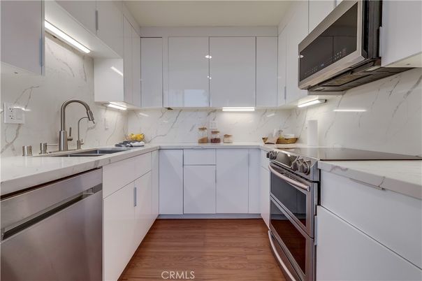 Interior, Kitchen, Marble Walls, Stainless Steel Appliances, Wood Texture Flooring