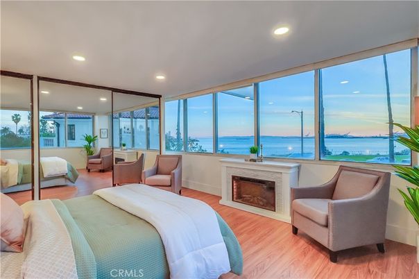 Bedroom, Fireplace, Interior, Recessed Lighting, Water, Wood Texture Flooring