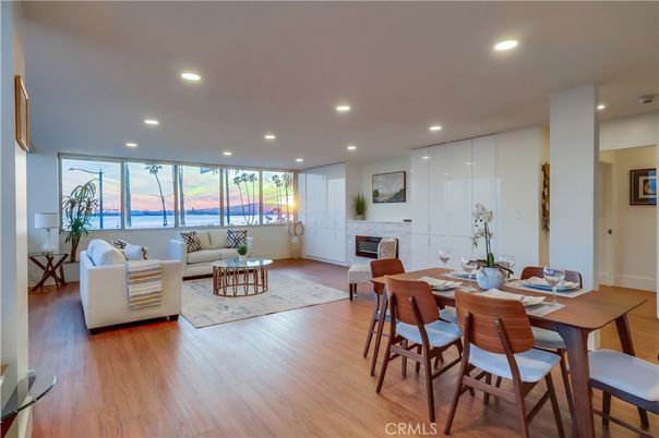 Dining room, Fireplace, Interior, Living room, Recessed Lighting, Water, Wood Texture Flooring