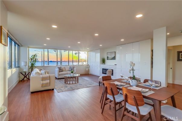 Dining room, Fireplace, Interior, Living room, Recessed Lighting, Water, Wood Texture Flooring