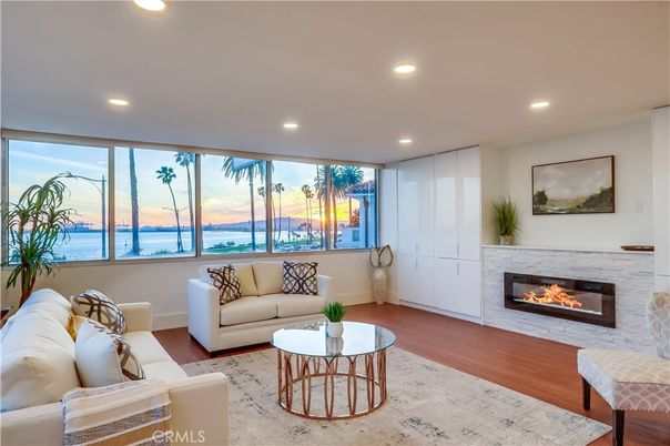 Fireplace, Interior, Living room, Recessed Lighting, Water, Wood Texture Flooring