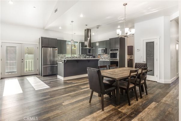 Dining room, Interior, Kitchen, Pendant Lights, Recessed Lighting, Stainless Steel Appliances, Wood Texture Flooring