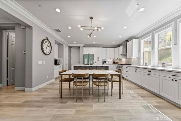 Dining room, Interior, Kitchen, Pendant Lights, Recessed Lighting, Stainless Steel Appliances, Wood Texture Flooring