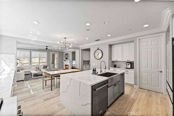 Dining room, Fireplace, Interior, Kitchen, Living room, Pendant Lights, Recessed Lighting, Stainless Steel Appliances, Wood Texture Flooring