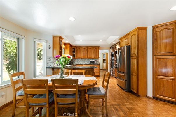 Dining room, Interior, Kitchen, Recessed Lighting, Stainless Steel Appliances, Wood Texture Flooring