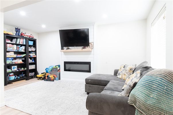 Fireplace, Interior, Living room, Recessed Lighting, Wood Texture Flooring
