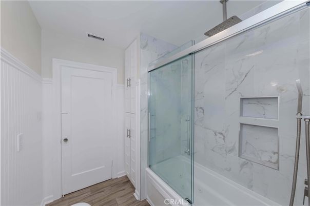 Bathroom, Glass Shower, Interior, Marble Walls, Wood Texture Flooring