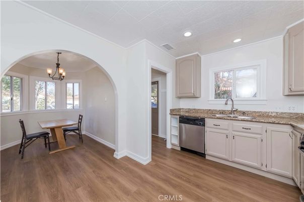 Chandelier, Dining room, Interior, Kitchen, Pendant Lights, Recessed Lighting, Stainless Steel Appliances, Wood Texture Flooring