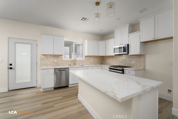 Interior, Kitchen, Pendant Lights, Recessed Lighting, Stainless Steel Appliances, Wood Texture Flooring