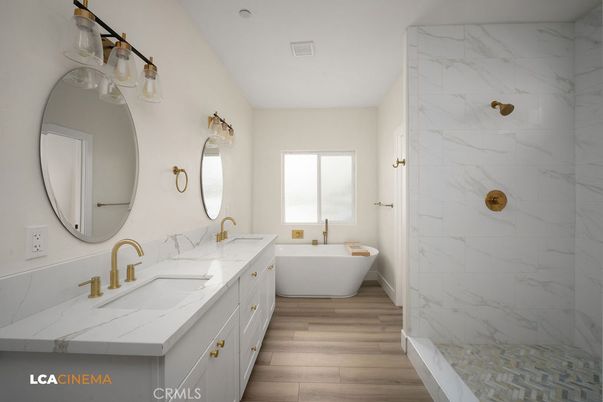 Bathroom, Dual Sink Vanities, Free Standing Baths, Interior, Marble Walls, Wood Texture Flooring