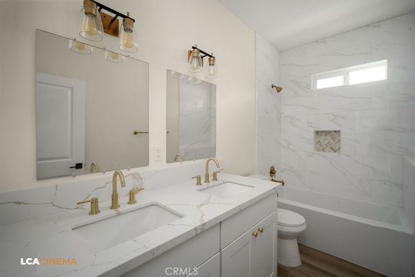 Bathroom, Dual Sink Vanities, Interior, Marble Walls, Wood Texture Flooring