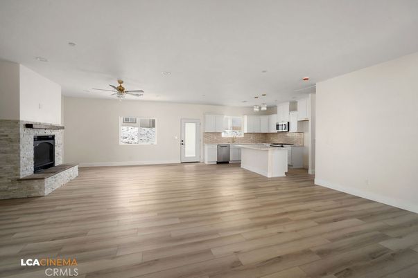 Empty room, Fireplace, Interior, Kitchen, Recessed Lighting, Wood Texture Flooring