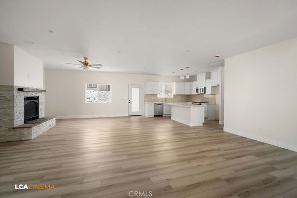 Empty room, Fireplace, Interior, Kitchen, Recessed Lighting, Wood Texture Flooring