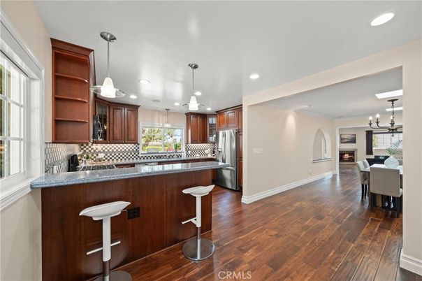 Chandelier, Dining room, Interior, Kitchen, Pendant Lights, Recessed Lighting, Stainless Steel Appliances, Wood Texture Flooring